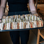 Set of 50 clear sandwich platter lids by Platterplus designed for large platter bases, perfect for catering and food presentation.
